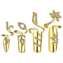 Set of gold nail art decorations with butterfly and leaf designs on a white background, Obroi