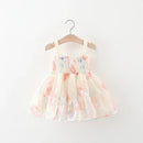 Floral dress on a hanger against a white background, Obroi