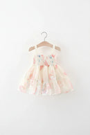 Floral dress on a hanger against a white background, Obroi