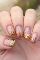 Nails with pink and gold glitter gradient on a blurred background, Obroi