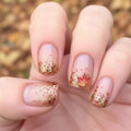 Nails with pink and gold glitter gradient on a blurred background, Obroi