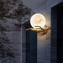 Decorative wall light fixture on a modern building exterior, Obroi