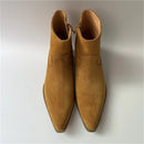 Pair of brown suede boots on a light gray background, Obroi