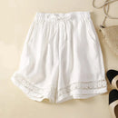 White lace-trimmed shorts on a beige background with 'Daily Evolution' text, Obroi