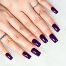 Close-up of hands with purple nail polish on a light background, Obroi