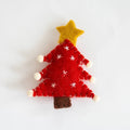Felt Christmas tree ornament with a star on a white , Obroi