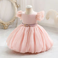 Pink dress on a mannequin against a decorative background, Obroi
