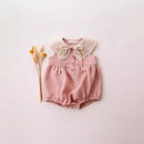 Pink baby romper with floral collar on a light pink background, Obroi