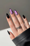 Hand with black and pink butterfly-themed nails on a neutral background, Obroi