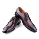 Pair of brown leather dress shoes on a white background