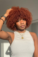 Woman with curly red hair posing outdoors, Obroi