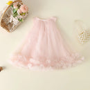 Pink tulle skirt with decorative flowers and jewelry on a light background, Obroi