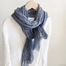 Blue scarf draped over a mannequin against a white background, Obroi