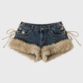 Denim shorts with fur trim on a light gray background, Obroi