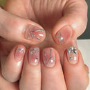 Nails with silver bow and crystal decorations on a neutral background, Obroi