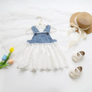 Children's denim overalls with white lace top, straw hat, shoes, and tulips on a light background, Obroi