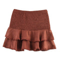 Brown skirt with ruffled layers on a white background, Obroi