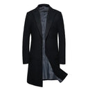 Black coat with a striped shirt underneath on a white background, featuring the Obroi brand.