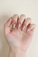 Hand with long, metallic pink nails on a plain background, Obroi