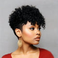 Woman with styled black hair wearing gold earrings against a gray background, Obroi