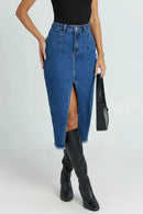 Person wearing a blue denim skirt with a high slit and black knee-high boots on a light gray background, Obroi