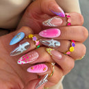 Close-up of a hand with colorful and decorative nails, Obroi