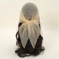 Black wig with a beige veil on a white background, Obroi