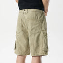 Beige cargo shorts worn by a person on a white background, Obroi