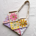 Crocheted bag with colorful flower patterns on a light gray background, Obroi