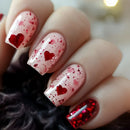 Nails with red heart and glitter design on a blurred background, Obroi