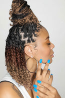 Two images showing a woman with styled hair and a close-up of ombre hair extensions, Obroi