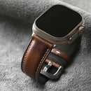 Smartwatch with a brown leather strap on a gray surface, Obroi