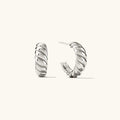 Silver hoop earrings on a white background with product details, Obroi