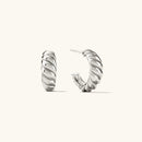 Silver hoop earrings on a white background with product details, Obroi