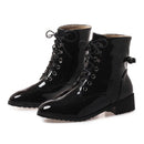 Black patent leather boots with laces on a white background, Obroi