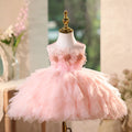 Pink dress on a mannequin with a blurred decorative background, Obroi
