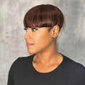 Woman with a stylish haircut against a neutral background, Obroi