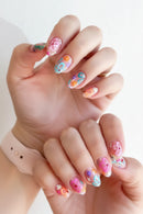 Hand with colorful nail art on a light background, Obroi