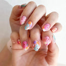 Hand with colorful nail art on a light background, Obroi