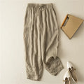 Beige pants with a notebook and shoes on a light background, Obroi