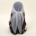 Light blue headscarf with a bow on a wig against a beige background, Obroi