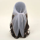 Light blue headscarf with a bow on a wig against a beige background, Obroi