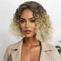 Woman with styled hair wearing a beige jacket against a neutral background, Obroi