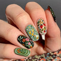 Close-up of a hand with intricately designed floral and nature-themed nails, Obroi