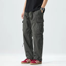 Person wearing gray cargo pants with a white background, Obroi