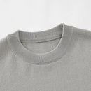 Close-up of a gray sweater collar on a light gray background, Obroi