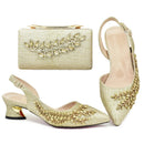 Gold embellished shoes and handbag set on a white background, Obroi