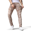 Person wearing beige jeans with a white background and 'Obroi' branding.