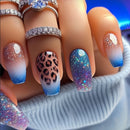 Nails with gradient and pattern designs, featuring rings on a neutral background, Obroi