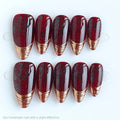 Set of red and gold nail tips on a white background, Obroi
